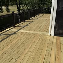 Wide view of wood decking with black perimeter railings