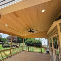 Tongue-and-groove pine ceiling with recessed lights and ceiling fan
