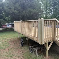 Side view of elevated wood pool deck and railings