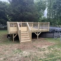 Front view of pool deck with central wooden stairs