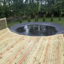 Wood decking beside an above-ground pool