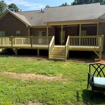Deck around a covered porch with central stairs