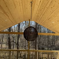 Finished tongue-and-groove pine ceiling and A-frame above the covered deck