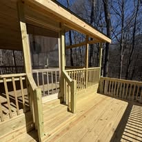 Wood posts and railing at the covered deck entrance