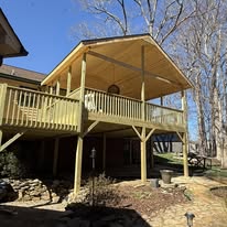 Raised covered deck viewed from the yard